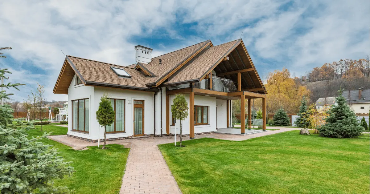 House in yard with brown roof